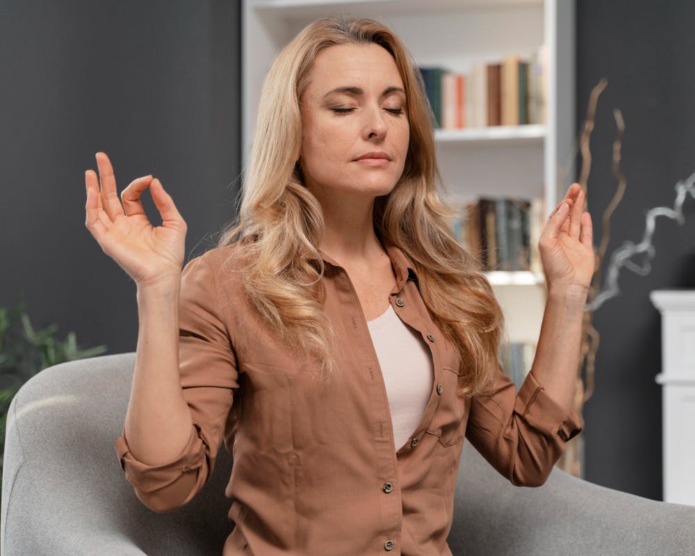 woman with closed eyes trying to calm herself