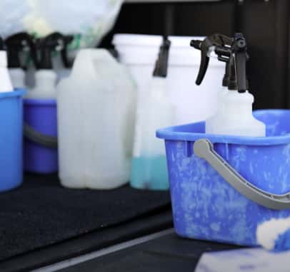 Bottles and cleaning equipment loaded in a asset cleaning UTE