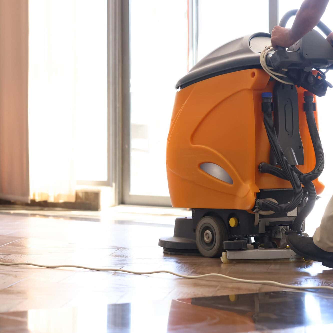 cleaning hall with washing vacuum cleaner closeup