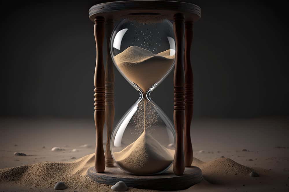 hourglass with sand in the middle and the word sand on it