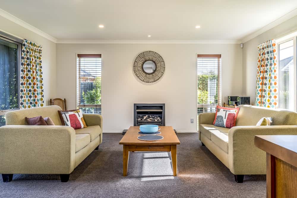 living room of a modern apartment with two identical sofas opposite each other