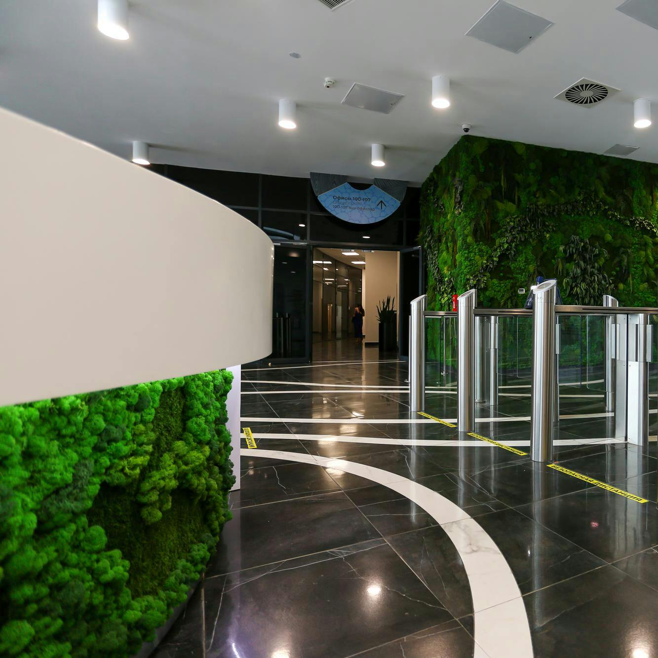 futuristic-green-hall-with-entrance-doors-reception-desk